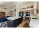 Bright open kitchen with a large island, stainless steel appliances, and seamlessly connected living spaces at 804 N Jamaica Way, Gilbert, AZ 85234