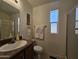 Bathroom featuring a shower, toilet, vanity and sink with decorative painting on the wall at 8700 E University Dr # 1024, Mesa, AZ 85207