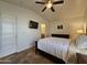 Well-lit bedroom with a TV, ceiling fan and ensuite bathroom at 8700 E University Dr # 1024, Mesa, AZ 85207