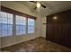 Well-lit bonus room with tiled flooring, a large cabinet, and multiple windows, ideal for storage at 8700 E University Dr # 1024, Mesa, AZ 85207