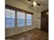 Versatile bonus room with ample natural light, tiled flooring, built in cabinet and convenient exterior access at 8700 E University Dr # 1024, Mesa, AZ 85207