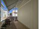 A view of the exterior side, featuring a narrow walkway and partial view of neighboring homes at 8700 E University Dr # 1024, Mesa, AZ 85207