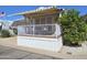 Charming porch view of a cozy home, showcasing a well-maintained exterior and inviting outdoor space at 8700 E University Dr # 1024, Mesa, AZ 85207