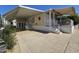 Inviting home exterior boasting a covered carport, front porch with awning, and manicured landscaping under clear skies at 8700 E University Dr # 1024, Mesa, AZ 85207
