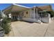 Well-maintained home with a spacious driveway, covered parking, and front porch at 8700 E University Dr # 1024, Mesa, AZ 85207