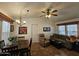 Living room area with ceiling fan, tile floor, and lots of light from the window at 8700 E University Dr # 1024, Mesa, AZ 85207