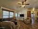 Inviting living room with tile floors, comfortable seating, and a ceiling fan at 8700 E University Dr # 1024, Mesa, AZ 85207