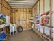 Inside the storage room with exposed wooden framing, shelving, and room for various items at 8700 E University Dr # 1024, Mesa, AZ 85207
