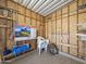 The inside of a bare storage area reveals a functional space with exposed wooden framing and shelving at 8700 E University Dr # 1024, Mesa, AZ 85207