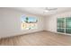 Bright bedroom with large window that brings in natural light and a view of the pool at 8732 E Forest Dr, Scottsdale, AZ 85257