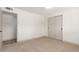 Bedroom with large closet space and neutral colored carpet at 8732 E Forest Dr, Scottsdale, AZ 85257