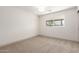 Bedroom with neutral carpet and window bringing natural light into the room at 8732 E Forest Dr, Scottsdale, AZ 85257