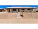 Charming single-story home featuring a modern design, desert landscaping, and a welcoming front porch at 8732 E Forest Dr, Scottsdale, AZ 85257