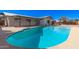 Sparkling pool with a covered patio, perfect for outdoor entertaining and relaxation at 8732 E Forest Dr, Scottsdale, AZ 85257