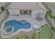 Aerial view of a backyard with a pool, spa, patio, and putting green at 8911 S 14Th Way, Phoenix, AZ 85042