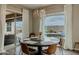 Dining area with a modern chandelier, backyard views, and seating for six at 8911 S 14Th Way, Phoenix, AZ 85042