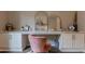 Home office features a large desk with storage and a stylish velvet chair at 8911 S 14Th Way, Phoenix, AZ 85042