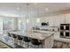 Modern kitchen island with granite countertops, pendant lighting, and bar stool seating at 8911 S 14Th Way, Phoenix, AZ 85042