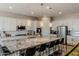 Spacious kitchen with a large island, stainless steel appliances, and white cabinetry at 8911 S 14Th Way, Phoenix, AZ 85042