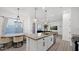 Open-concept kitchen island complements the dining area, with modern lighting and neutral tones at 901 S Smith Rd # 1013, Tempe, AZ 85281