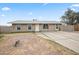 Charming single-story home featuring a well-maintained lawn and a welcoming facade at 907 N Menze St, Casa Grande, AZ 85122