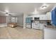 Bright, open kitchen featuring stainless steel appliances and white cabinetry with modern granite countertops at 907 N Menze St, Casa Grande, AZ 85122