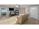 Comfortable living room with ceiling fan, neutral paint, and tile flooring throughout the home at 907 N Menze St, Casa Grande, AZ 85122