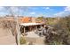 Beautiful aerial view of the back of the house with a covered patio and desert landscaping at 9110 E Clubhouse Ct # 639, Scottsdale, AZ 85262