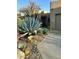 Landscaped front yard with desert plants and a walkway leading to the front door of this lovely home at 9110 E Clubhouse Ct # 639, Scottsdale, AZ 85262