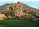 Picturesque golf course featuring natural rock formations and desert flora under a backdrop of rugged mountains at 9110 E Clubhouse Ct # 639, Scottsdale, AZ 85262