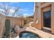 Relaxing hot tub area with desert plants and a private entry gate, creating a serene retreat at 9110 E Clubhouse Ct # 639, Scottsdale, AZ 85262