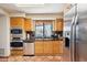 Bright kitchen featuring stainless steel appliances, granite counters, and a view at 9110 E Clubhouse Ct # 639, Scottsdale, AZ 85262
