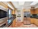 Bright kitchen with stainless steel appliances, granite counters, and a skylight at 9110 E Clubhouse Ct # 639, Scottsdale, AZ 85262