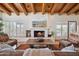 Inviting living room with fireplace, comfortable seating, and serene desert landscape view at 9110 E Clubhouse Ct # 639, Scottsdale, AZ 85262