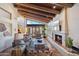 Spacious living area with wood-beamed ceilings, a fireplace, and comfortable seating at 9110 E Clubhouse Ct # 639, Scottsdale, AZ 85262