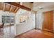 Living space featuring terracotta tile, wood beams, and doors that lead outside at 9110 E Clubhouse Ct # 639, Scottsdale, AZ 85262