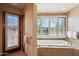 Spa-like bathroom with a soaking tub and views of the outdoors at 9110 E Clubhouse Ct # 639, Scottsdale, AZ 85262