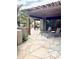 Relaxing patio area with lounge chairs, wooden pergola, and flagstone flooring at 9110 E Clubhouse Ct # 639, Scottsdale, AZ 85262