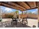 Charming outdoor patio with desert landscaping features a pergola with seating for relaxing outdoors at 9110 E Clubhouse Ct # 639, Scottsdale, AZ 85262