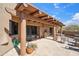 Inviting outdoor patio with grill offers desert landscaping, a pergola, and a cozy seating area at 9110 E Clubhouse Ct # 639, Scottsdale, AZ 85262