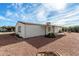 Exterior rear view of home featuring desert landscaping and a covered patio at 9139 E Aspen Ave, Mesa, AZ 85208