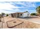 Quaint single-story home featuring a covered carport and drought-tolerant landscaping at 9139 E Aspen Ave, Mesa, AZ 85208