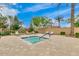 Relaxing community hot tub surrounded by lounge chairs and desert landscaping at 925 S Storment Ln, Gilbert, AZ 85296