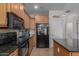 Contemporary kitchen with stainless steel appliances, granite countertops, and plenty of cabinet space at 925 S Storment Ln, Gilbert, AZ 85296