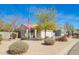 Single Gathering home with a well maintained desert landscaped front yard with an American flag at 9630 E Hay Loft Dr, Florence, AZ 85132