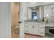 Bright bathroom features dual sinks, granite countertop, white cabinets, and a separate toilet room at 9818 E Talon Ave, Mesa, AZ 85212