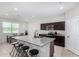 Bright kitchen features granite countertops, island with seating, and stainless steel appliances at 1060 W Castle Ct, Casa Grande, AZ 85122