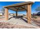 Outdoor picnic area with covered seating and desert landscaping; a perfect place to gather with friends and Gathering at 1060 W Castle Ct, Casa Grande, AZ 85122