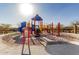 Community playground with colorful equipment and safety features, perfect for enjoyment at 1060 W Castle Ct, Casa Grande, AZ 85122