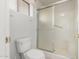 Bathroom featuring toilet and glass-door shower at 10856 E Kiva Ave, Mesa, AZ 85209